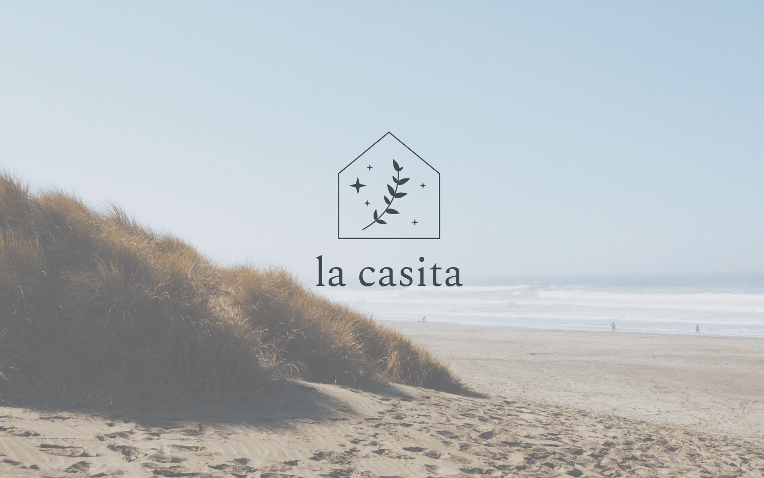Serene beach with La Casita logo overtop